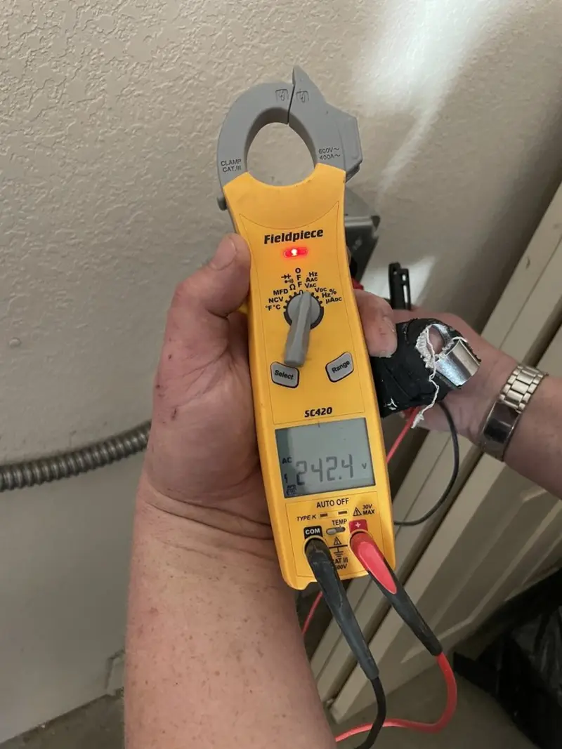 Voltage testing with clamp meter during Ceiling Fan Installation in Newington Forest